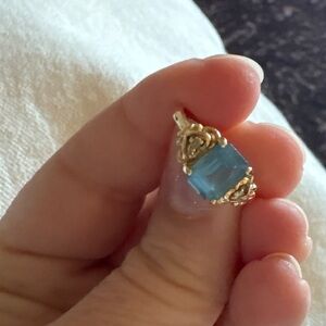 Yellow gold ring with emerald cut blue aquamarine gemstone